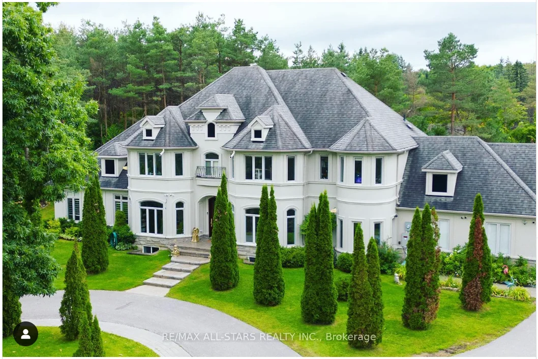 Estate exterior surrounded by mature trees